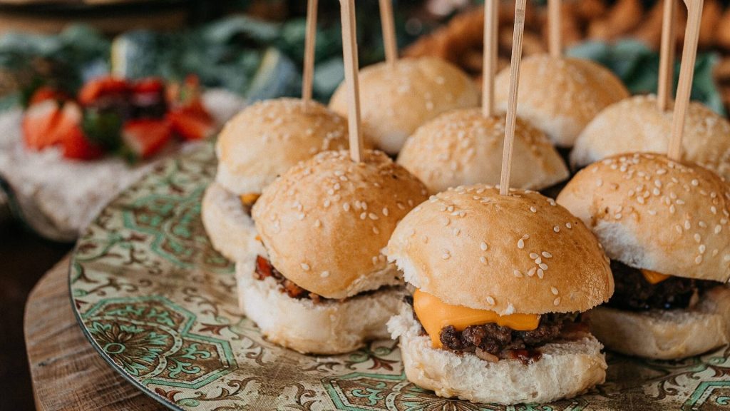 Mini hamburgers on a platter.